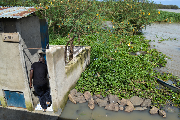  A pit latrine at Dunga Beach in Kisumu, Kenya, empties directly into Lake Victoria. It is one of numerous streams of untreated human waste entering the lake. Photo credit: Isaiah Esipisu.