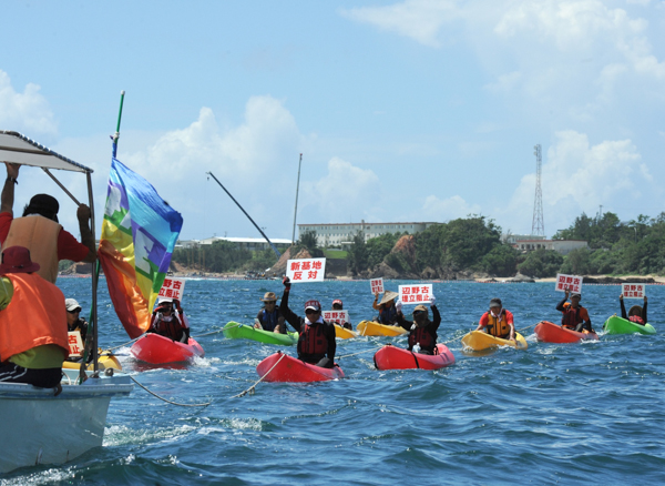 Kayakers rally against the construction of a new US air base in Okinawa in August 2014. Photo credit: Photo credit: ©Greenpeace / Kayo Sawaguchi.