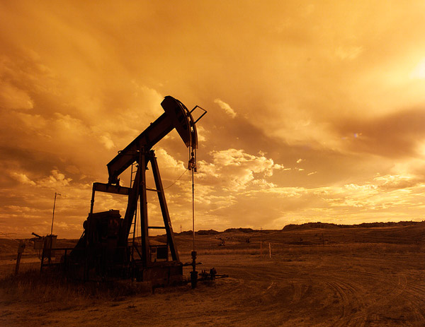 A pump jack silhouetted at sunset near Casper, Wyoming. Photo credit: US DOE.
