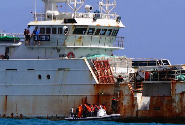 Authorities in Cape Verde board the Songhua, a vessel known to poach toothfish in the Southern Ocean. Photo credit: Sea Shepherd/Josephine Watmore
