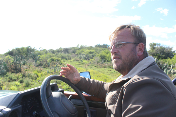 Jacques Matthysen, a ranger at Kariega Private Game Reserve in Eastern Cape province, gives the author a tour of the reserve. In 2012, poachers brutally hacked the horns off three living rhinos at Kariega. Only one survived. Photo credit: Mic Smith.