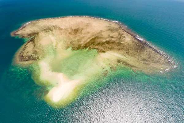 An offshore coral cay where octopus are fished. Photo copyright: Garth Cripps / Blue Ventures 2015.