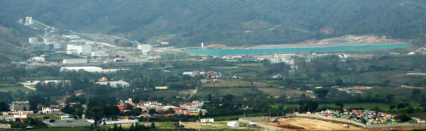 Tahoe Resources' underground Escobal silver mine sits at the base of a hill little more than a mile from the center of town in San Rafael las Flores, pictured above in the left foreground. The grey buildings in the left background and the water body are part of the mine development. Photo credit: Sandra Cuffe.