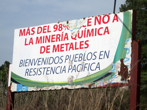 Large signs announcing that 98 percent of people oppose metallic mining are placed in communities and municipalities where referendums and consultations have taken place. This sign, situated outside the community of San Juan Bosco, reads 'Welcome To Communities in Peaceful Resistance.' Photo credit: Sandra Cuffe.